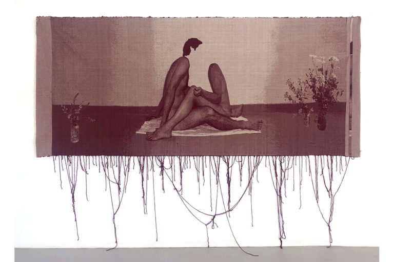 A maroon woven tapestry depicts photographic images of two nude individuals that is intimate