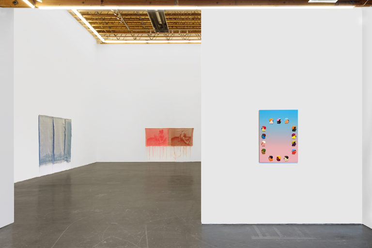 Installation image of Head(less), of one painting and two woven tapestry hanging on the wall of the gallery.