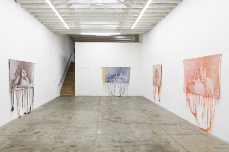 Installation image of Mia Weiner’s Foreplay at OCHI, Los Angeles, CA. Various weavings are installed on the gallery wall.
