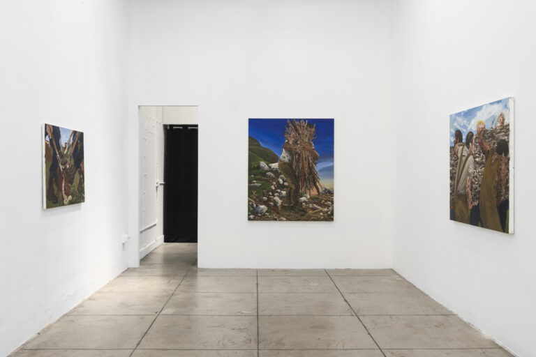 Installation image for Demarco Mosby Quietly Persisting show, about three paintings depicting the humans with their features blurred doing the deforestation